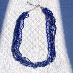 Beaded multi string adjustable length necklace